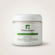 White jar of PharmaSpa Eucalyptus spa crystals with green label for respiratory wellness