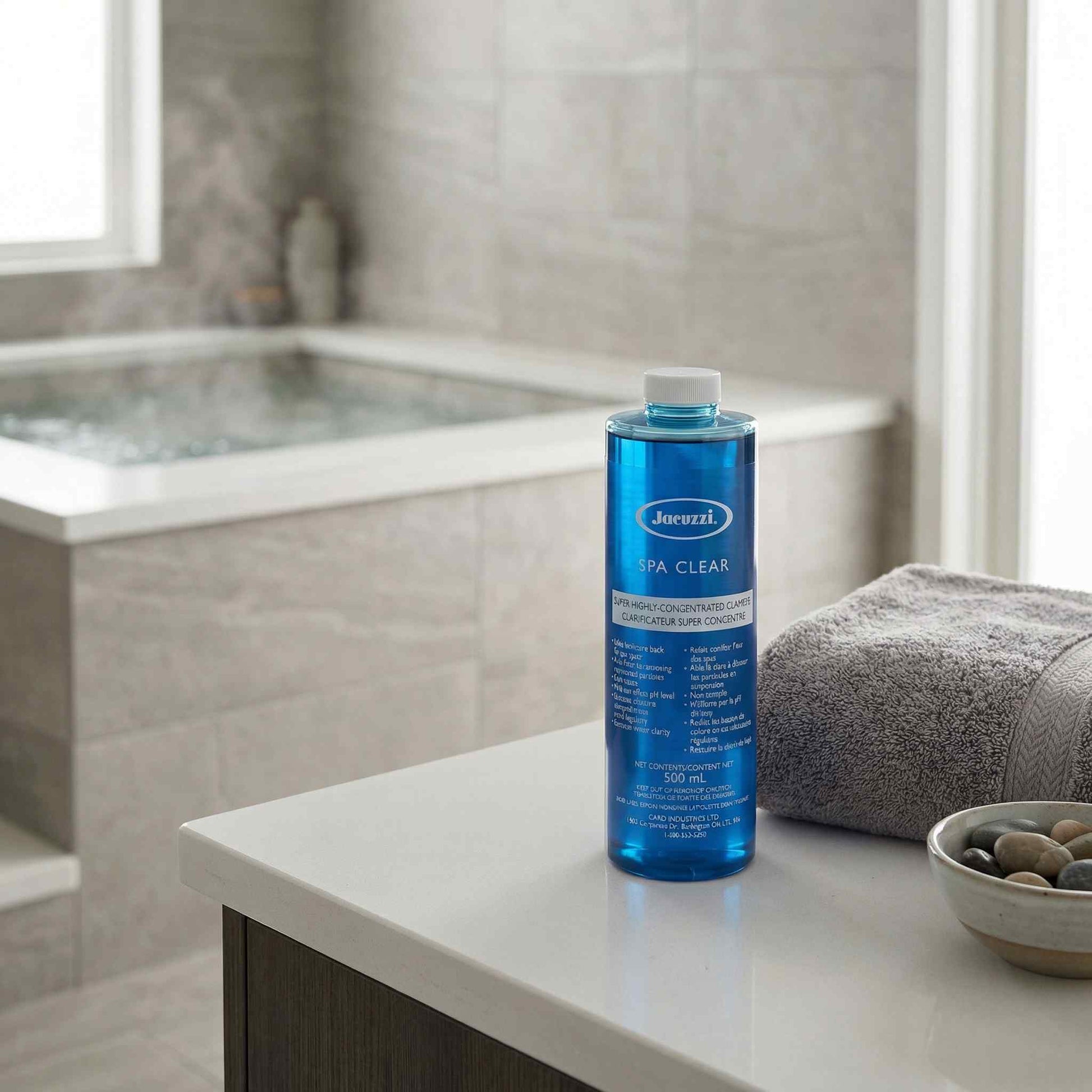 Blue bottle of Jacuzzi Spa Clear on a bathroom counter with a bathtub in the background