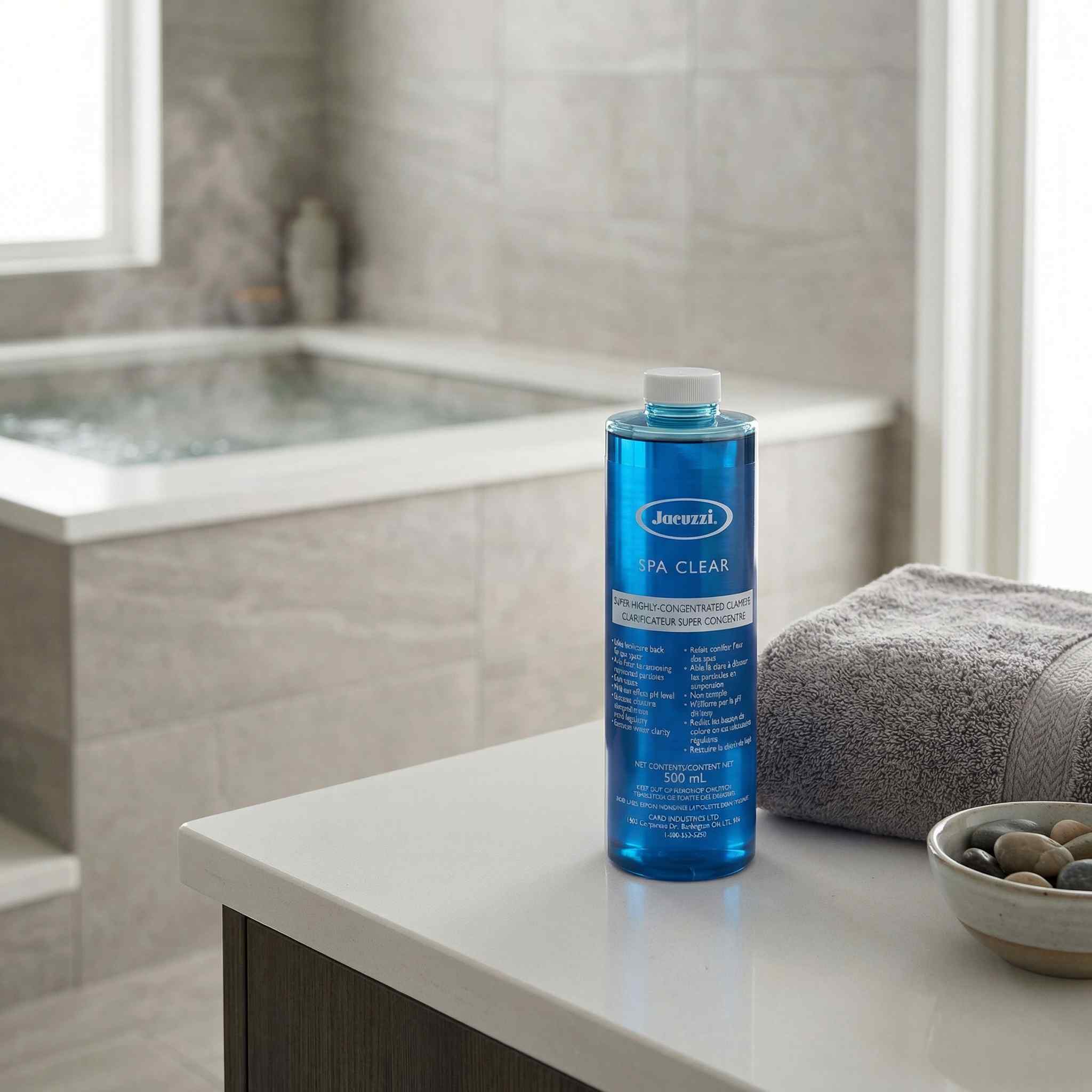 Blue bottle of Jacuzzi Spa Clear on a bathroom counter with a bathtub in the background
