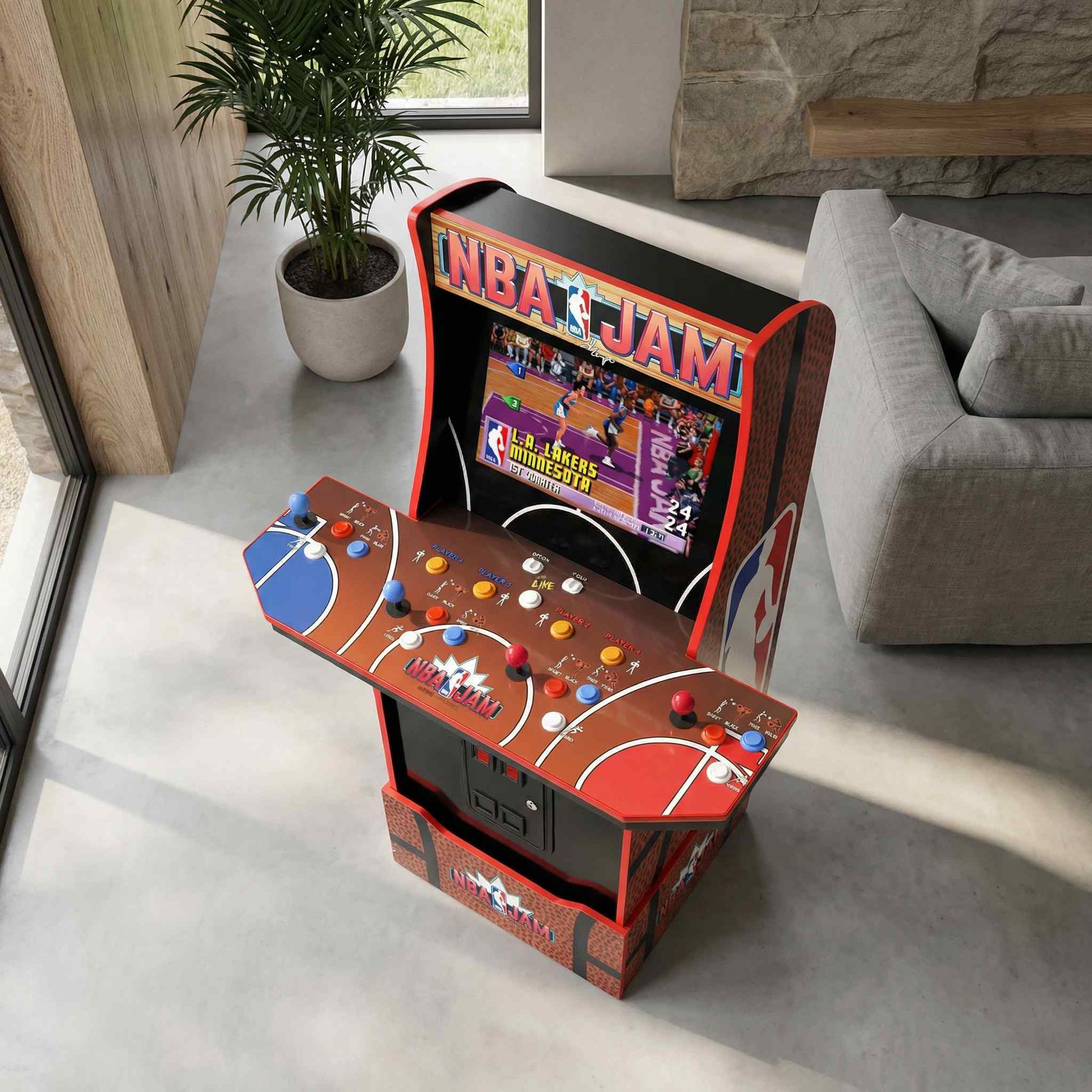 Miniature NBA Jam arcade cabinet in a living room setting with a plant and sofa.