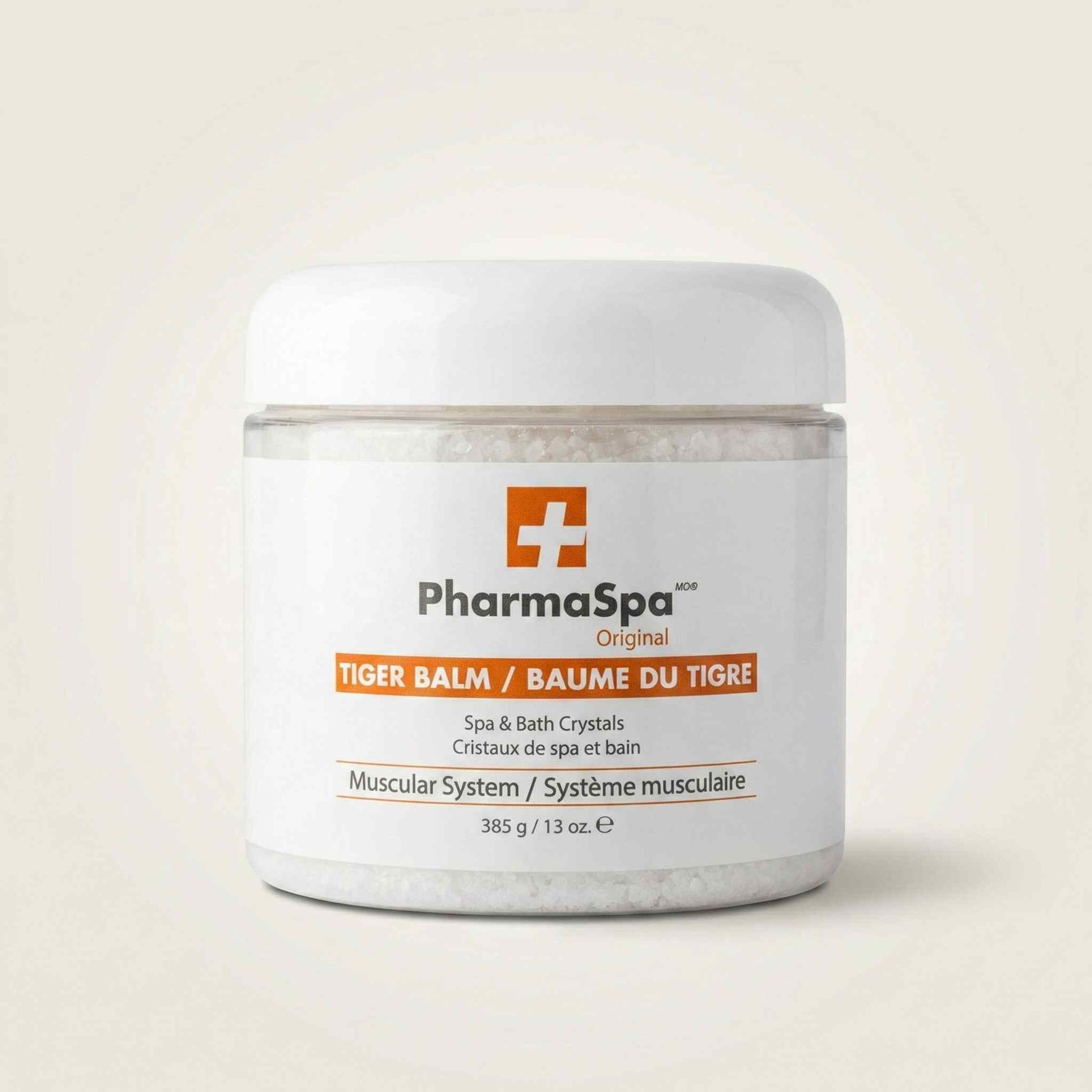 White jar of PharmaSpa Tiger Balm spa and bath crystals with red and orange label