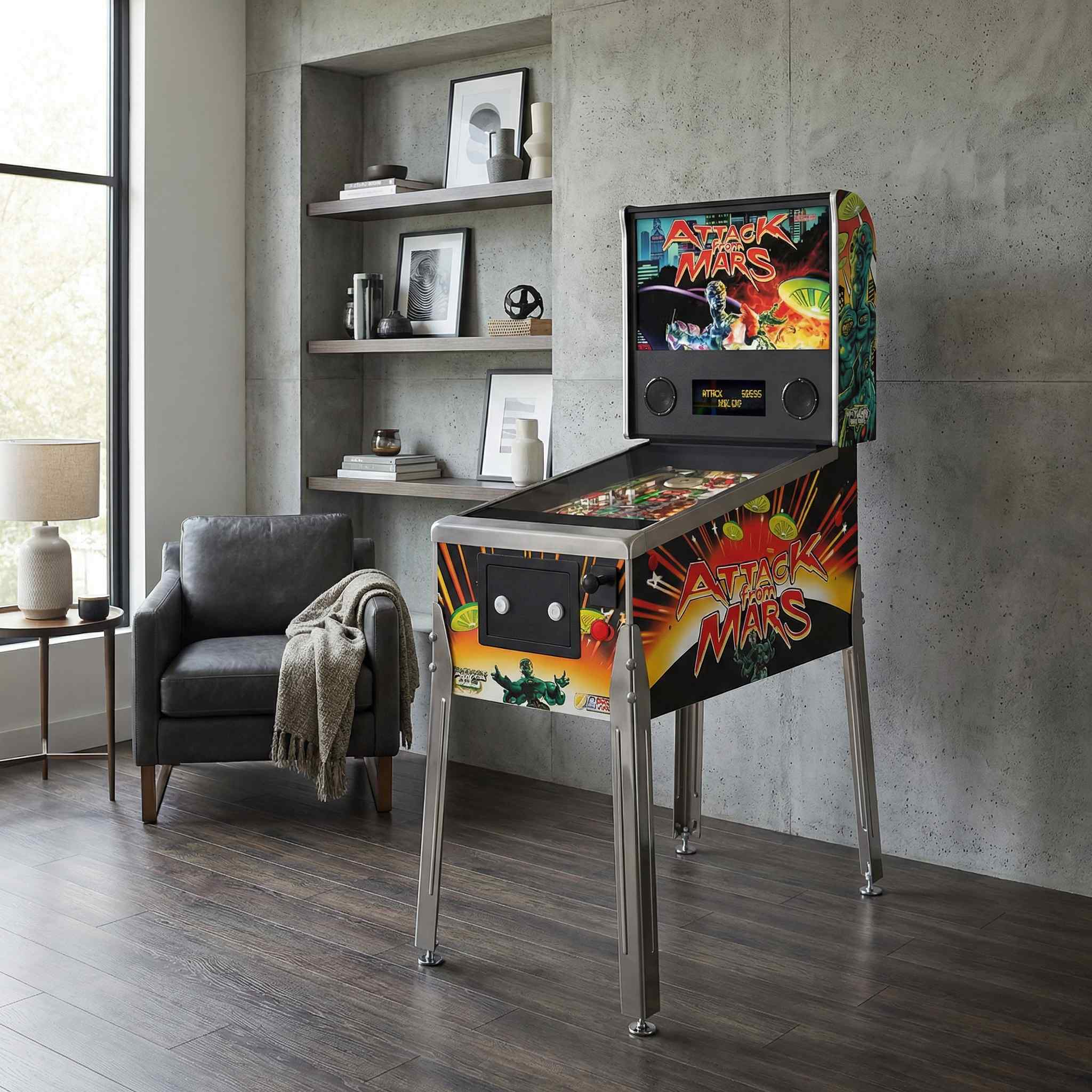 Attack on Mars pinball machine displayed in a modern living room beside a grey sectional sofa