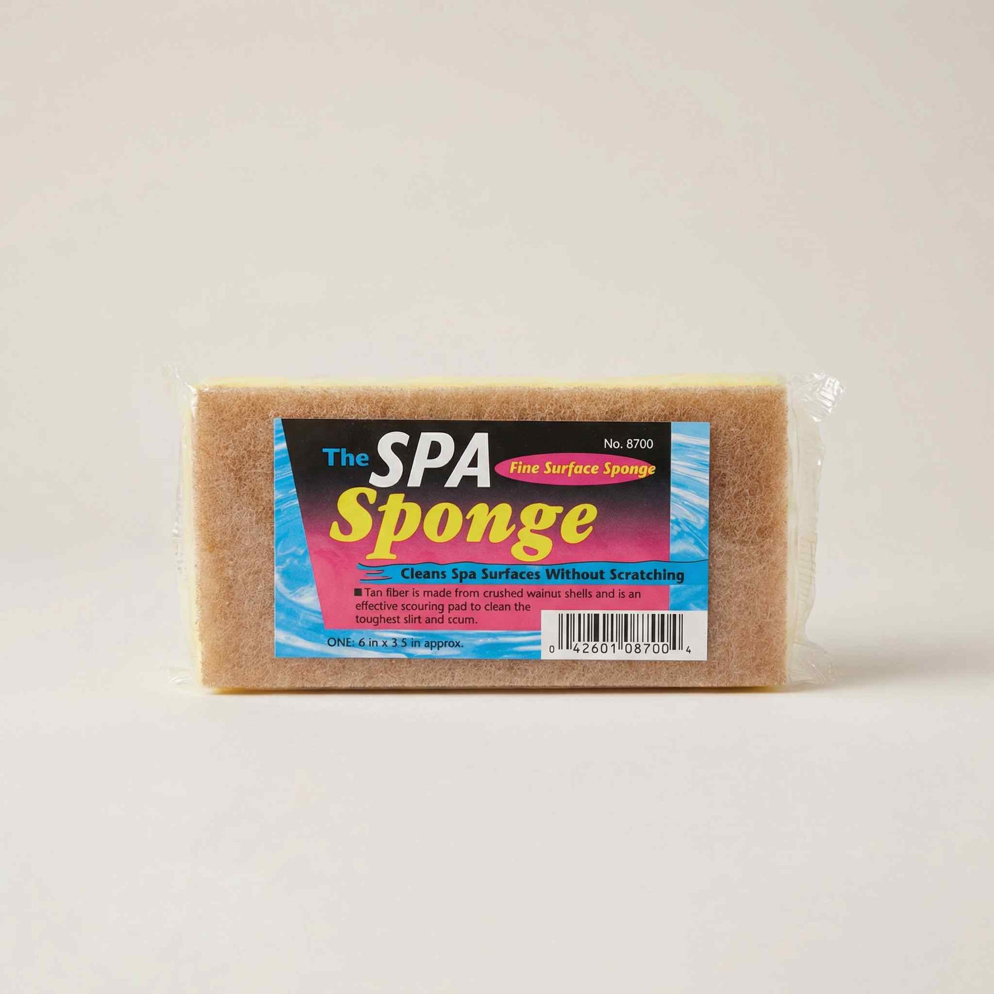 The Spa Sponge tan rectangular cleaning sponge in colourful branded packaging on white background