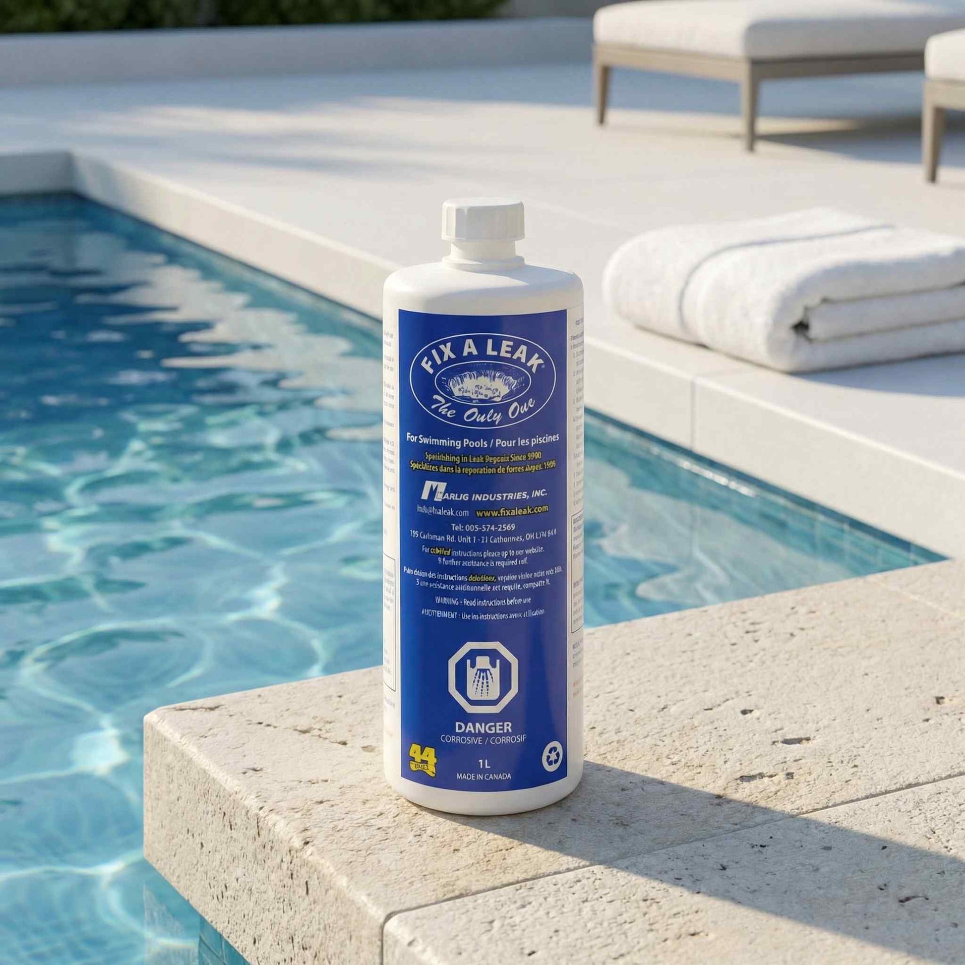 Fix-A-Leak bottle displayed poolside on a stone deck beside a turquoise swimming pool