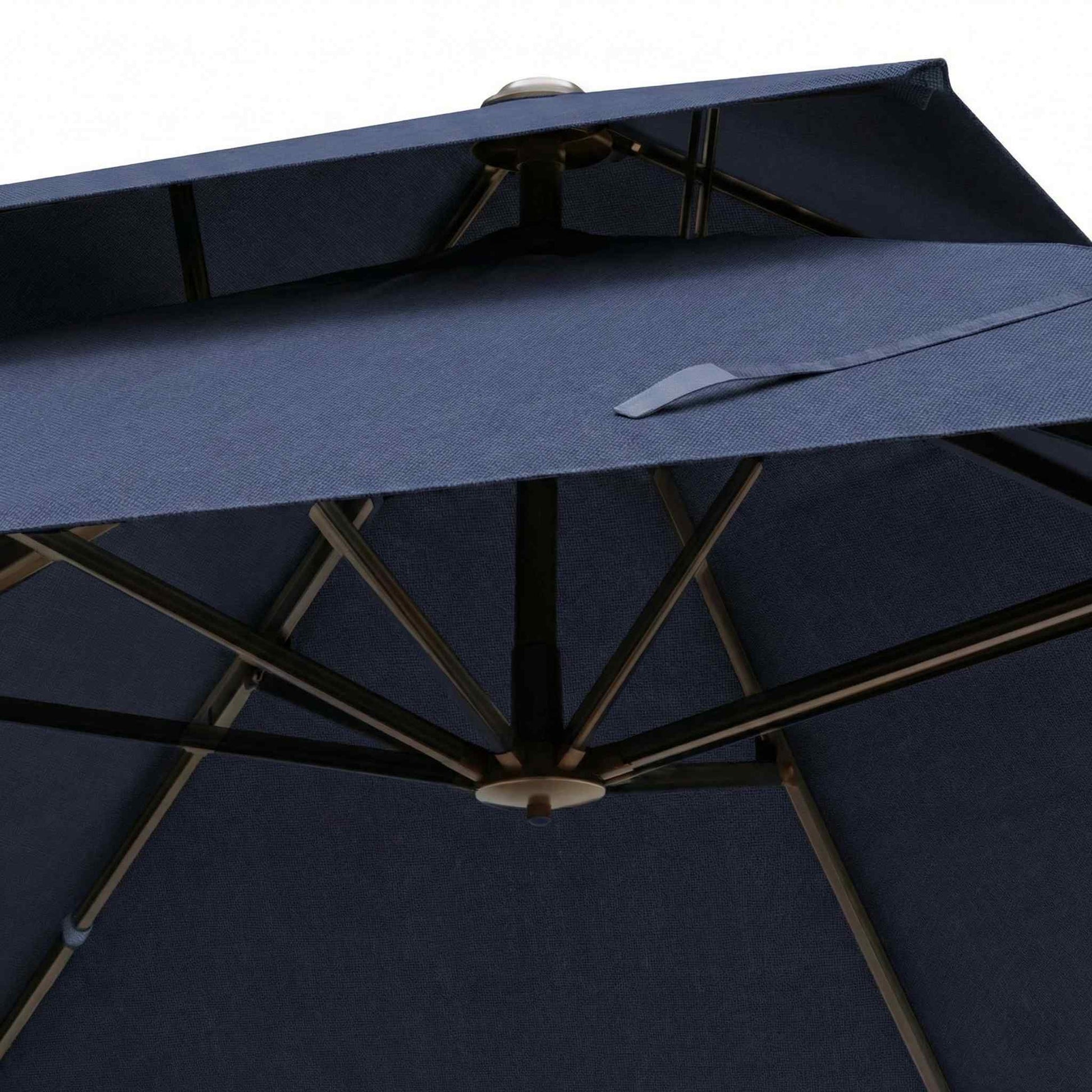 Close-up of a navy blue patio umbrella with wooden frame on a white background